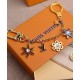 Replicas Louis Vuitton LV Snowflakes Bag Charm And Key Holder M80240 Dorado Baratos Imitacion